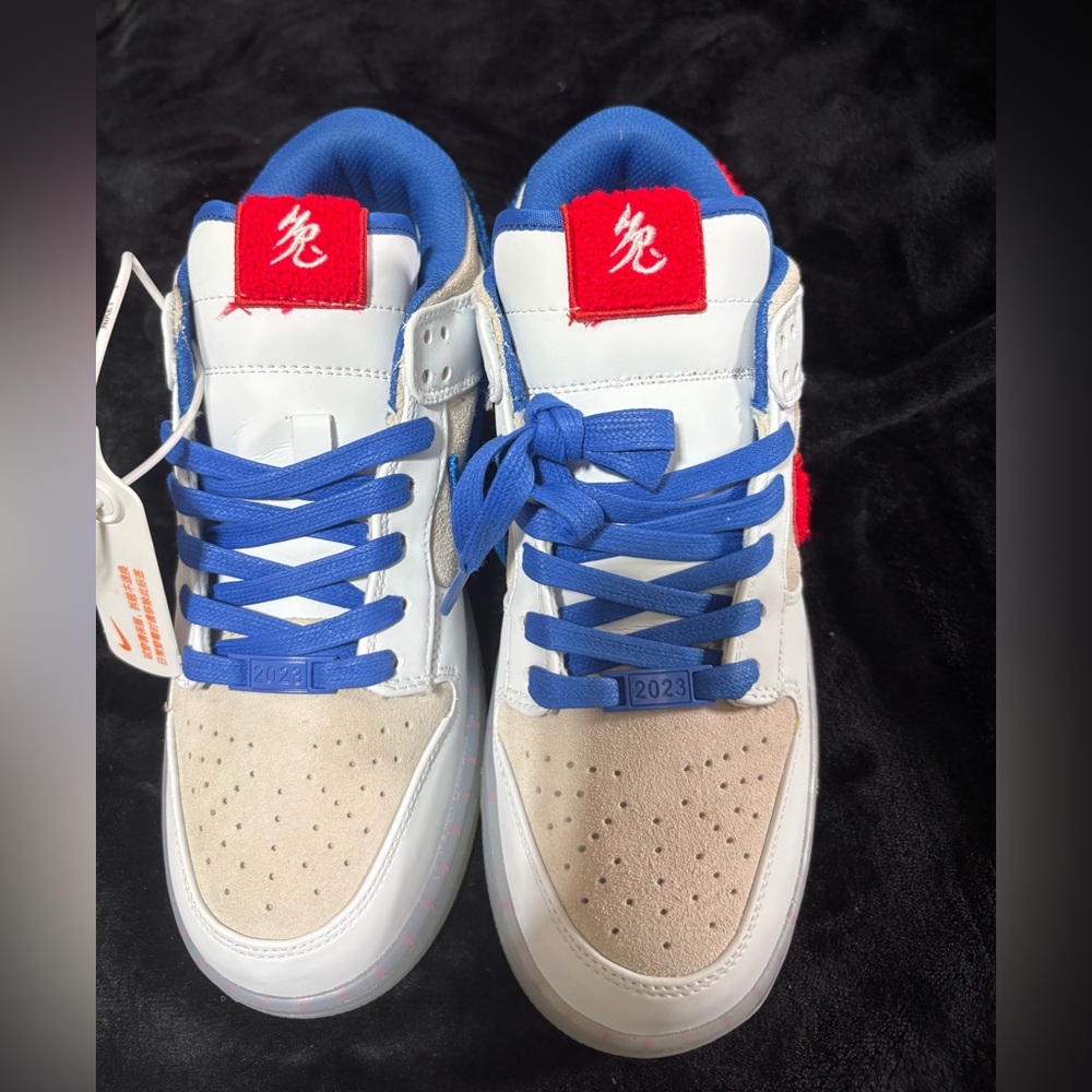Nike dunk year of the rabbit, Blue and White Sneakers with Red Accents